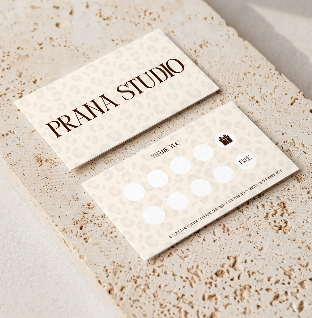 Editable loyalty card template for beauty professionals, Leopard Cream · Gift Reward design, front and back shown on travertine