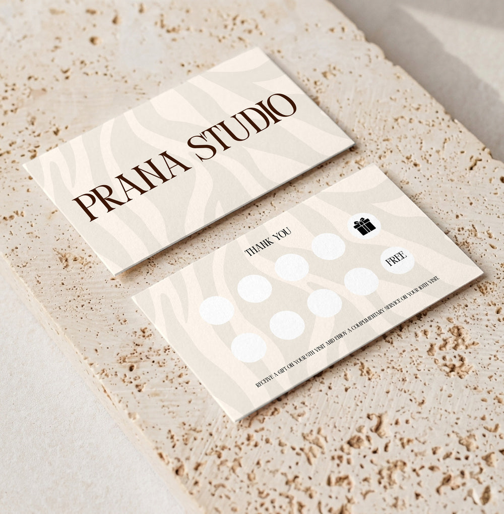 Editable loyalty card template for beauty professionals, Zebra Cream · Gift Reward design, front and back shown on travertine