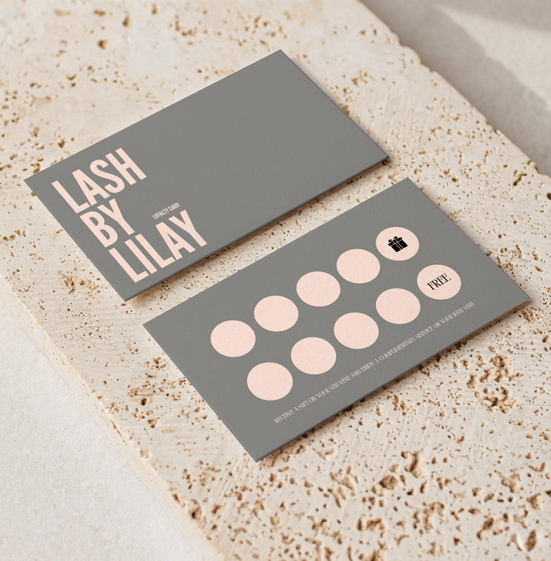 Grey and pink lash loyalty card template for beauty professionals, front and back on porous travertine