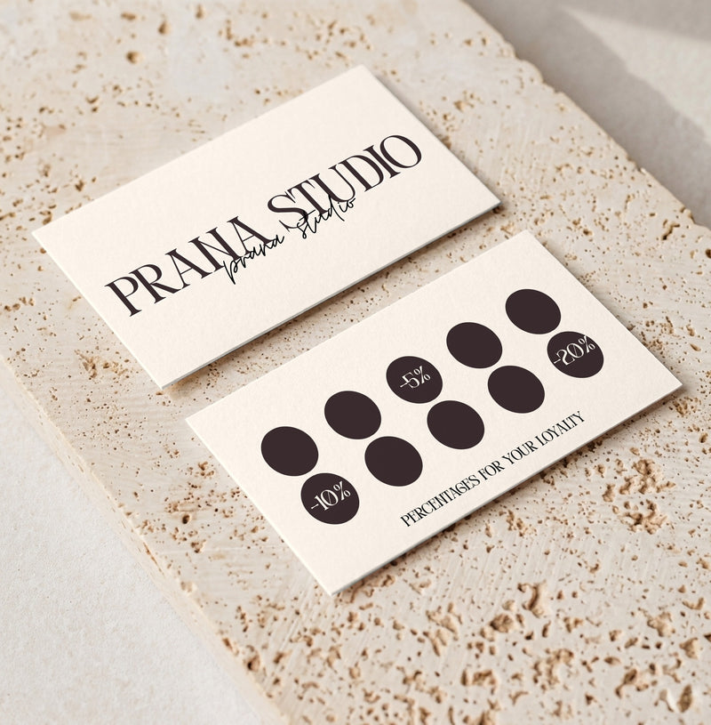 Editable loyalty card template for beauty professionals, Cream Signature · Percentage Rewards design, front and back shown on travertine