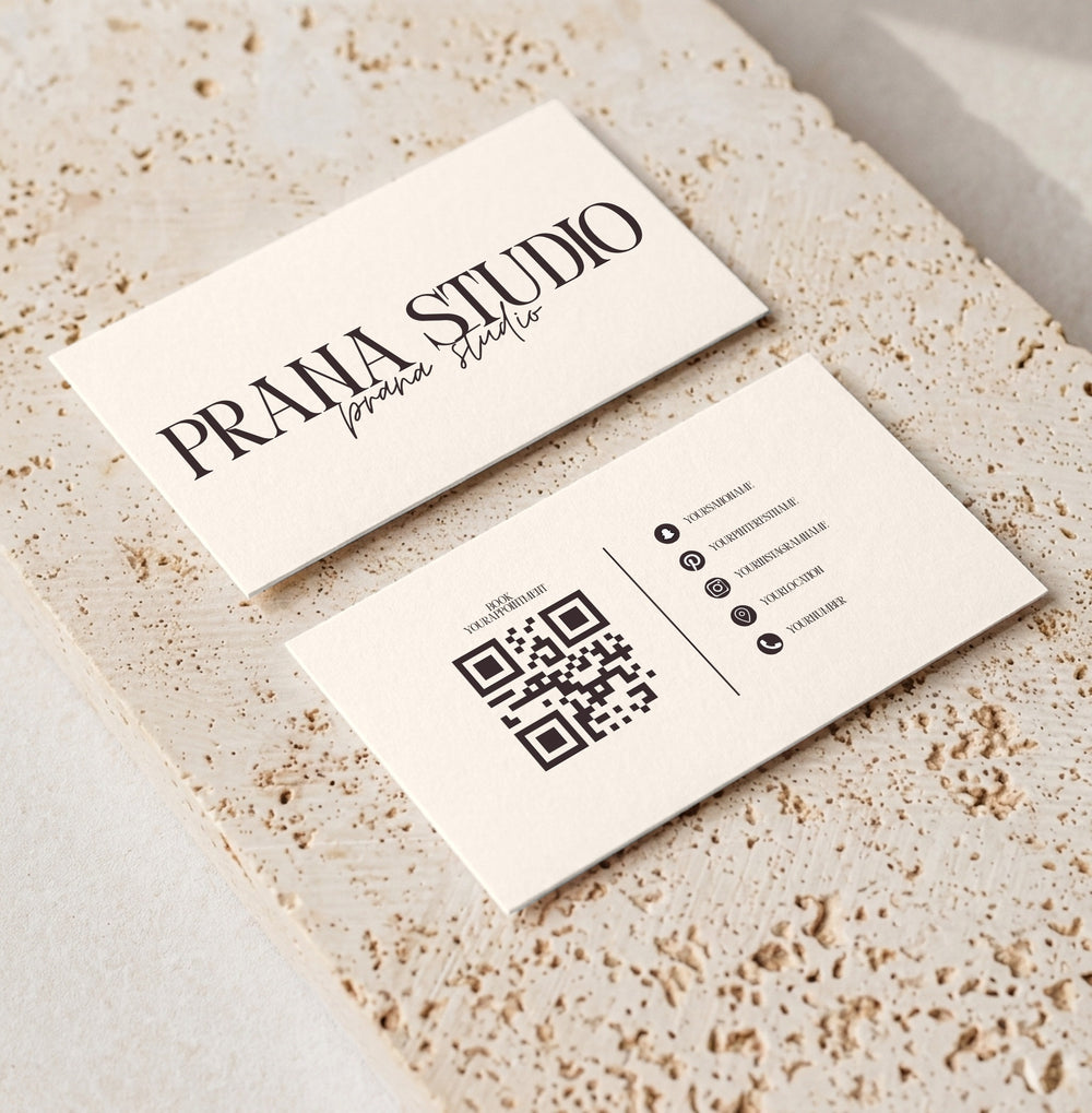 Editable loyalty card template for beauty professionals, Cream Signature · QR & Socials design, front and back shown on travertine