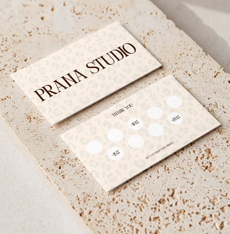 Editable loyalty card template for beauty professionals, Leopard Cream · Percentage Rewards design, front and back shown on travertine