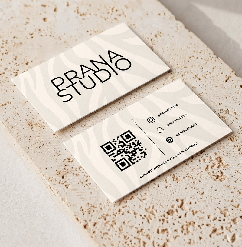 Editable loyalty card template for beauty professionals, Zebra Cream · Modern QR design, front and back shown on travertine